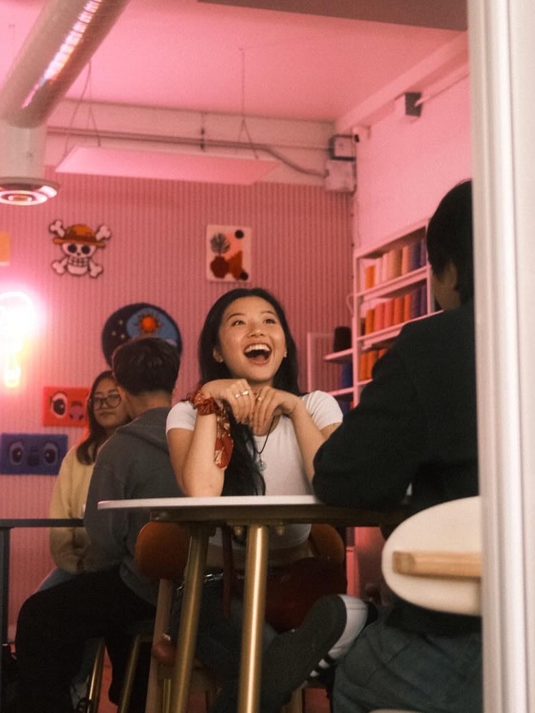 Anna Ma laughing at a table at one of her events